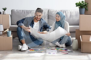 Creative muslim family working on design for new house