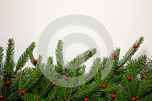 Creative New Year's border from Christmas tree branches. Place for text. Christmas background in retro style. New Year
