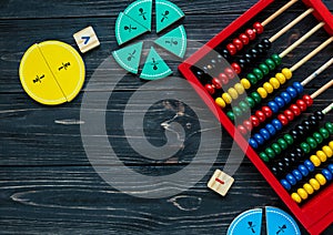 Creative Ð¡olorful math fractions on dark background. Interesting funny math for kids. Education, back to school concept