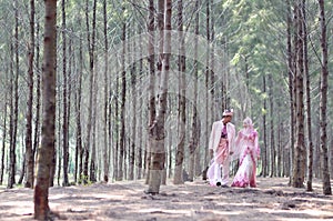 Creative outdoor photoshoot of a malay loving couple bride and groom