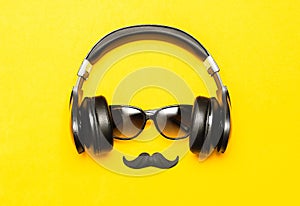 Creative party decoration concept. Black mustache, Sunglasses, headphones for music, props for photo booths carnival parties on