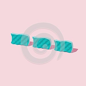 Creative pastel mint and pink composition made with dish washing sponges. Trendy, minimal spring cleaning concept