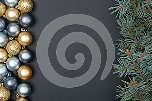 Creative pattern with Christmas tree branches, silver and gold baubles. Concept