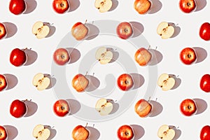 Creative pattern made of apple fruits on white background with shadow. Healthy food and vitamin concept. Minimal style. Top view.