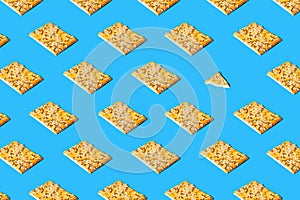 Creative pattern made of crunchy cereal cookies bright blue background. Healthy dessert concept