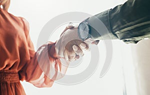 Creative people, handshake and partnership in meeting, b2b deal or teamwork below at office. Low angle of man and woman