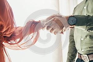 Creative people, handshake and teamwork in meeting, b2b deal or partnership together at office. Closeup of man and woman