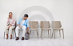 Creative people, waiting room and chairs in hiring, row or opportunity together at office. Group of employees sitting in