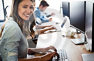 Creative people working in office on computer