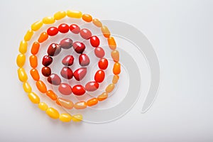 Creative photo design of various colorful cherry tomatoes on white background. Top view of colorful cherry tomatoes, flat lay