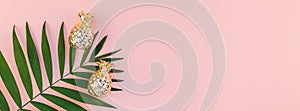 Creative pink background with tropical palm leaves