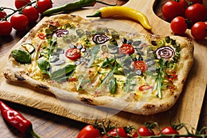 Creative pizza slice: Flower Garden with vegetables, pumpkin seeds, green onion, Hollandaise sauce and hot chili.
