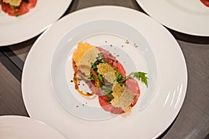 Creative Plate of Beef Carpaccio Salad.