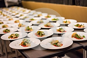 Creative Plate of Beef Carpaccio Salad Being Plated