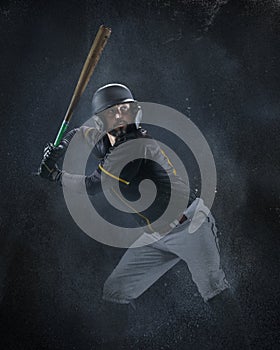 Creative portrait of professional baseball player in sports equipment getting ready to hit isolated on smoked background
