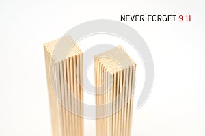 Creative poster in honor of September 9, skyscrapers of the World Trade Center carved wood breadboard models. Memory of the attack