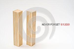 Creative poster in honor of September 9, skyscrapers of the World Trade Center carved wood breadboard models. Memory of the attack