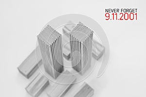 Creative poster in honor of September 9, skyscrapers of the World Trade Center carved wood breadboard models. Memory of the attack