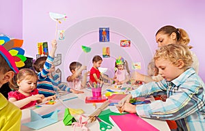 Creative preschool children with teacher