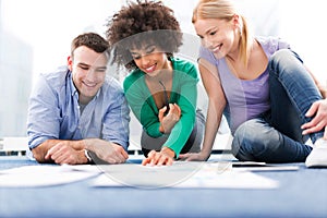 Creative professionals working on floor