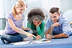 Creative professionals working on floor