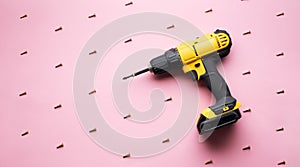 Creative provocation: a yellow screwdriver on a pink background and small screws. photo