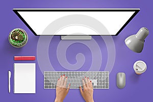 Creative purple desk scene. Designer studio with isolated screen for mockup