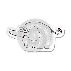 A creative retro distressed sticker of a cartoon elephant squirting water