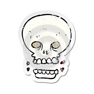 A creative retro distressed sticker of a cartoon scary skull