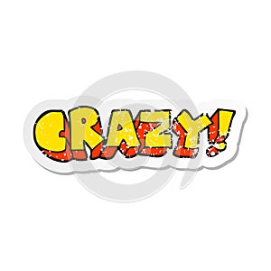 A creative retro distressed sticker of a cartoon shout crazy