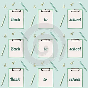 Creative seamless pattern with office supplies, white and green colored pens and  paper tablet with clip