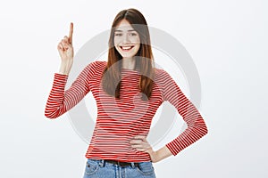 Creative smart girl has one excellent idea. Studio shot of confident good-looking european woman in casual outfit