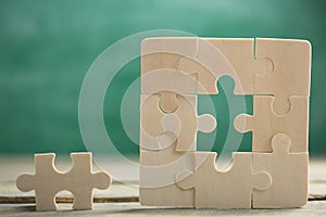 Creative solution for idea - business concept, jigsaw puzzle on the blackboard