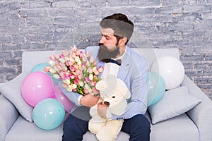 Creative solutions for all your floral needs. Spring flowers. Bearded man with flowers. Love date. international holiday