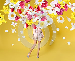 Creative spring composition. Posing girl and flowers splash