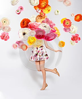 Creative spring composition. Dancing girl and flowers splash