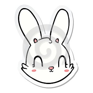 A creative sticker of a cartoon bunny face