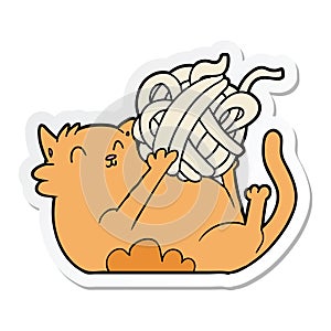 A creative sticker of a cartoon cat playing with ball of string