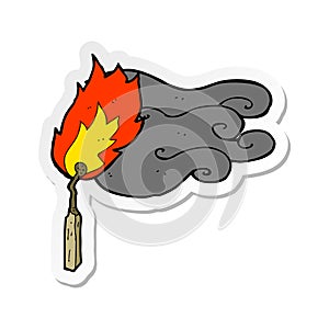 A creative sticker of a cartoon flaming match