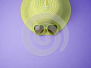 Creative summer background with hat and sunglasses