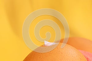 Creative sunscreen concept. Brown eggs like thighs. A drop of cream on the front buttock.