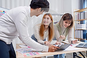 Creative Team Collaborating on UX UI Design Project in Modern Office Environment