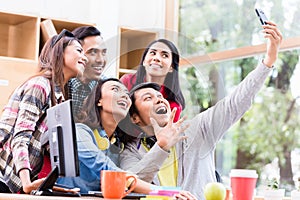 Creative team of five enthusiastic employees making a selfie photo photo