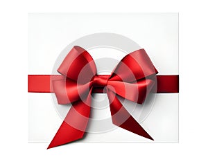 Red ribbon bow on card note white background wrapping. Copy text space