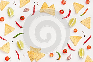 Creative Top view flat lay of fresh mexican food ingredients with tortilla nachos chips garlic pepper lime tomatoes on white table