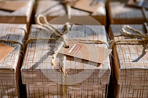 creative twine and tag embellishments on kraft boxes photo