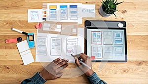 Creative UIUX designer sketching a mobile app prototype