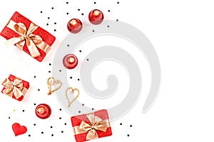 Creative Valentine`s Day greeting card with red decorations and gift boxes, golden heart confetti on white background, copy space