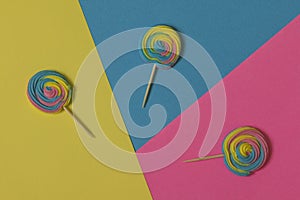 Creative view of colorful, handmade swirl lollipop in summer col