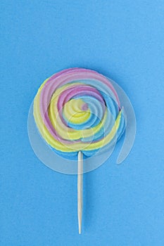 Creative view of colorful, handmade swirl lollipop in summer col